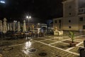 The Council Square during rain in Brasov, Romania. View with famous buildings in evening .