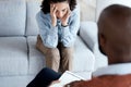 Counselling, therapy and depression of black woman with mental health problem on psychologist couch. Patient person Royalty Free Stock Photo