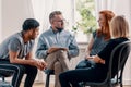 Counselor talking to his patients during treatment