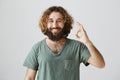 Count on me, deal is ours. Portrait of confident friendly easter male with beard and curly hair showing okay or great
