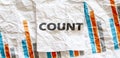 COUNT word text on the white memo note crupled sticker on chart background Royalty Free Stock Photo