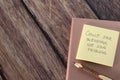 Count your blessings, not problems, handwritten quote, pencil and notebook on wooden table