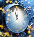 Countdown Christmas midnight. Christmas clock covered with fresh snow shows five to twelve Royalty Free Stock Photo