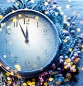 Countdown Christmas midnight. Christmas clock covered with fresh snow shows five to twelve Royalty Free Stock Photo