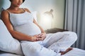 And the countdown to baby begins. a pregnant young woman relaxing on the bed at home. Royalty Free Stock Photo