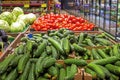 counter with fresh cucumbers, tomatoes, cabbage. Grocery store. Royalty Free Stock Photo