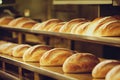 Counter with fresh soft baked bread on blurry background
