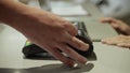 On the counter in the hotel reception desk,Close up hand making payment with credit card machine terminal while swiping debit card