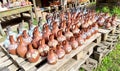 A counter with jugs and ceramic handicrafts made in Georgian national style put up for sale