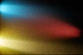 Counter light rays of pink blue and yellow on a dark background Royalty Free Stock Photo