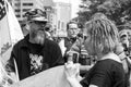 Counter Protestor Argues with Rifle Carrying Militia Members Demonstrating in Columbus, OH.