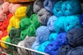 Counter in shop for knitting and needlework with coils colored wool yarn. Different bright colors threads in store Royalty Free Stock Photo