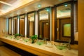 Counter sinks for wash hands and face with mirrors in the mall. Royalty Free Stock Photo