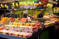 Counter with Tasty fruit smoothies,variety of fruits at the Boqueria market in Barcelona.Fresh Natural Juice For Sale In Royalty Free Stock Photo