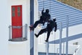 Counter-terrorism Police Officers Abseiling A Building