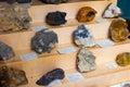 Counter with various semi-precious and ornamental stones. Names of stones in Spanish. Spain