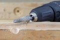Countersink used in joinery for reaming holes. Joinery accessories on a workshop table