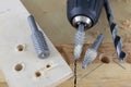 Countersink used in joinery for reaming holes. Joinery accessories on a workshop table