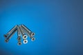 Countersunk wood screws on a blue background Royalty Free Stock Photo