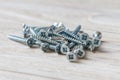 Countersunk wood screws on a wooden background Royalty Free Stock Photo