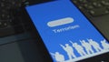 Counterterrorism inscription on smartphone screen with blue background. Graphic presentation with silhouettes of