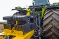 Counterweight mounted behind a powerful, modern tractor Royalty Free Stock Photo