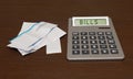 Counting bills on calculator Royalty Free Stock Photo