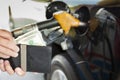 counting money with gasoline refueling car Royalty Free Stock Photo
