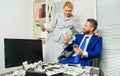 Counting money profit. Man businessman and woman secretary with pile dollar banknotes. Profit and richness concept