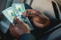 Counting paper money. Close-up of a man's hands counting dollar bills. The concept of earnings and business