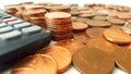 Counting the Pennies - Stacks of Pennies Beside a Calculator Royalty Free Stock Photo