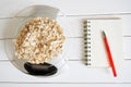 Counting and recording the amount of calories, proteins, carbohydrates and fats in food. Flakes from four cereals on kitchen Royalty Free Stock Photo