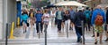 countless people walking around on a sunny day in a street in the center of Lisbon