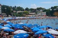 Countless tourists flood the idyllic beach in the beautiful Croatian seaside.