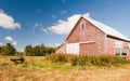 Country barn in autumn field Royalty Free Stock Photo