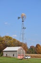 Country Barn in the Fall with Windmill Royalty Free Stock Photo