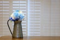 Country Blue Flowers in Pewter Pitcher on Kitchen Counter Royalty Free Stock Photo