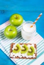 Country breakfast. Toast with cottage cheese and slices of kiwi, juicy green apples and home yogurt without sugar. Healthy eating. Royalty Free Stock Photo
