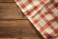 Country charm Red checkered tablecloth gracing a rustic wooden table Royalty Free Stock Photo