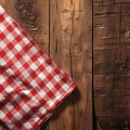 Country charm Red checkered tablecloth gracing a rustic wooden table Royalty Free Stock Photo