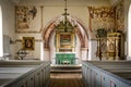 Country-church with reredos of wood and fine frescoes,