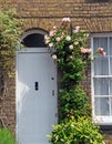 Country cottage door roses Royalty Free Stock Photo