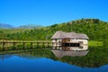 Country cottage floating in a lake Royalty Free Stock Photo