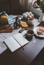 Country cottage kitchen with breakfast on wooden table.