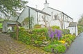 Country cottage with Spring flowers Royalty Free Stock Photo