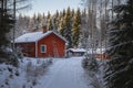 Country cottage surrounded by snow-covered forest Royalty Free Stock Photo