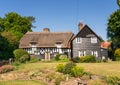 British English country cottage with thatched roof and cottage garden. Hertfordshire. UK Royalty Free Stock Photo