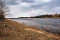 country forest river in early spring with no vegetation on the shores Royalty Free Stock Photo