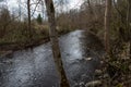 country forest river in early spring with no vegetation on the shores Royalty Free Stock Photo