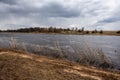 country forest river in early spring with no vegetation on the shores Royalty Free Stock Photo